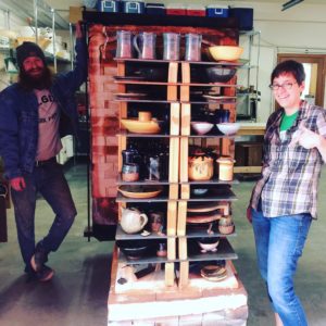Katie Teesdale and Levi Yankosky with the big gas kiln 