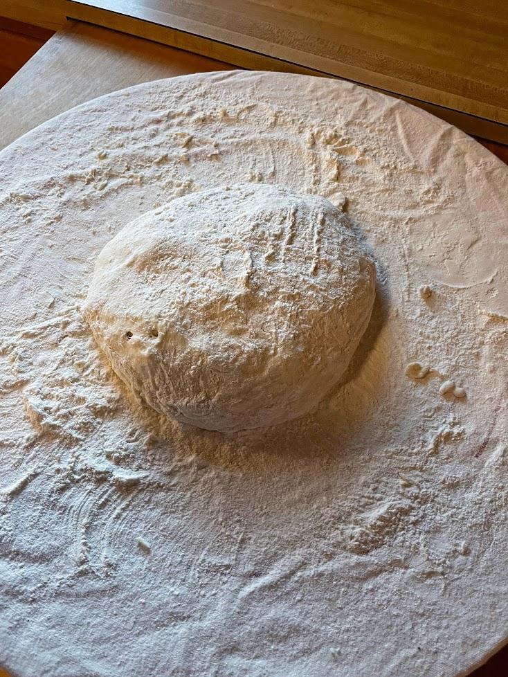 https://www.claycoyote.com/clay-coyote-no-knead-bread-baking-recipes-variations-and-techniques/bread-ball-on-flour-board/