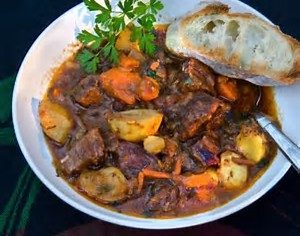photo of meat, potatoes, and carrots in a stew in a bowl