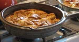 photo of an apple pie in a skillet on the stove top