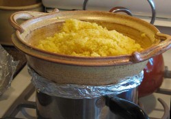 photo of couscous in a clay couscous steamer