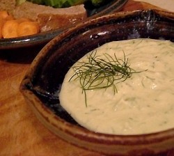 photo of a white dip in a ceramic bowl