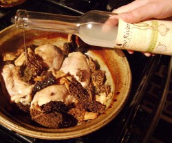 photo of chicken and mushrooms in a tagine on the stove