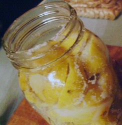 photo of a jar with lemons and sugar in it
