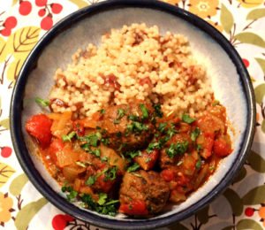 photo of a plate of couscous and meatballs