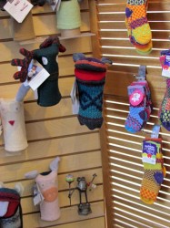 photo of knit socks hanging on a display wall