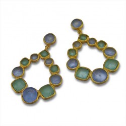 photo of gold earrings with blue and green jewels