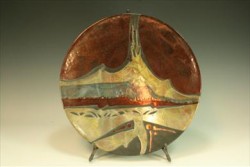 photo of a red and tan ceramic plate