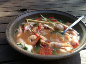 photo of a shrimp gumbo soup in a bowl with a spoon