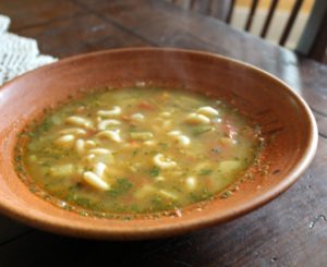 photo of a ceramic bowl of soupe au pistou