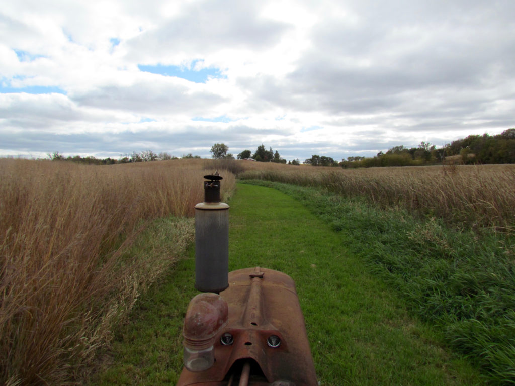 1945 International H driving through prairie 