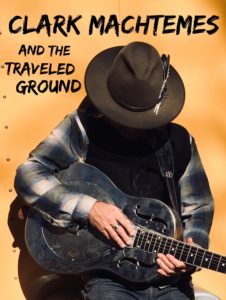 Photo of a concert poster with a man in a cowboy hat holding a guitar