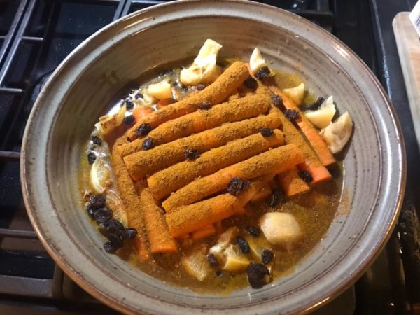 photo of carrots lined up in the tagine