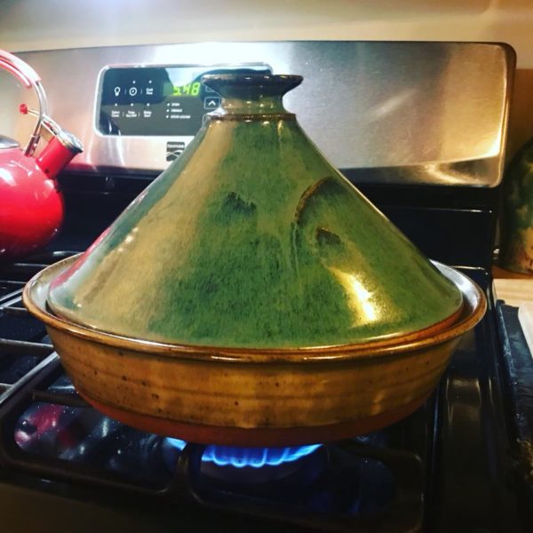 photo of a blue tagine on a stove