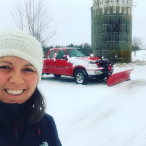 photo of a red F150 truck with a plow on it