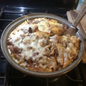 Clay Coyote Savory Pie Dish in action with a pasta, cheese, meat sauce. 