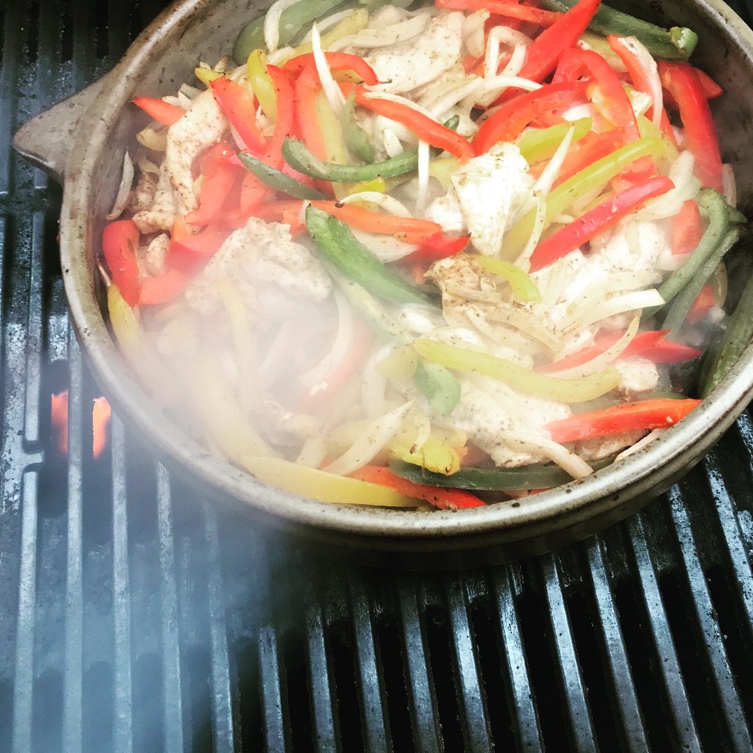 Chicken Fajitas in a clay grill basket made by the Clay Coyote in Hutchinson, MN