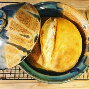 bread baker in joe's blues with sourdough loaf at the clay coyote in hutchinson mn