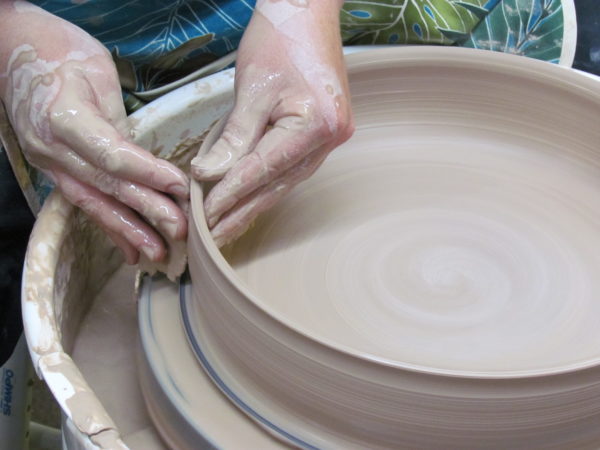 Potters hands in the Clay Coyote Studio