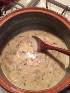 Dutch Oven in Flameware handmade by the Clay Coyote in Hutchinson MN in action in the kitchen