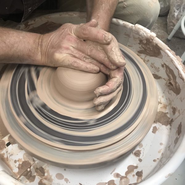 Dutch Oven in Flameware handmade by the Clay Coyote in Hutchinson MN being thrown on the pottery wheel