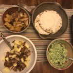 Two types of al pastor, tortillas, and avocado spread