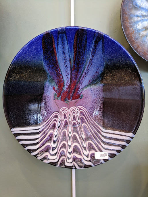 A Matthew Patton plate hanging on the wall
