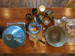 Everything needed for chicken tagine set on a table