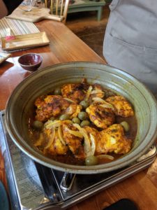 Finished chicken tagine with preserved lemon, green olives, and thyme made in a Clay Coyote Tagine