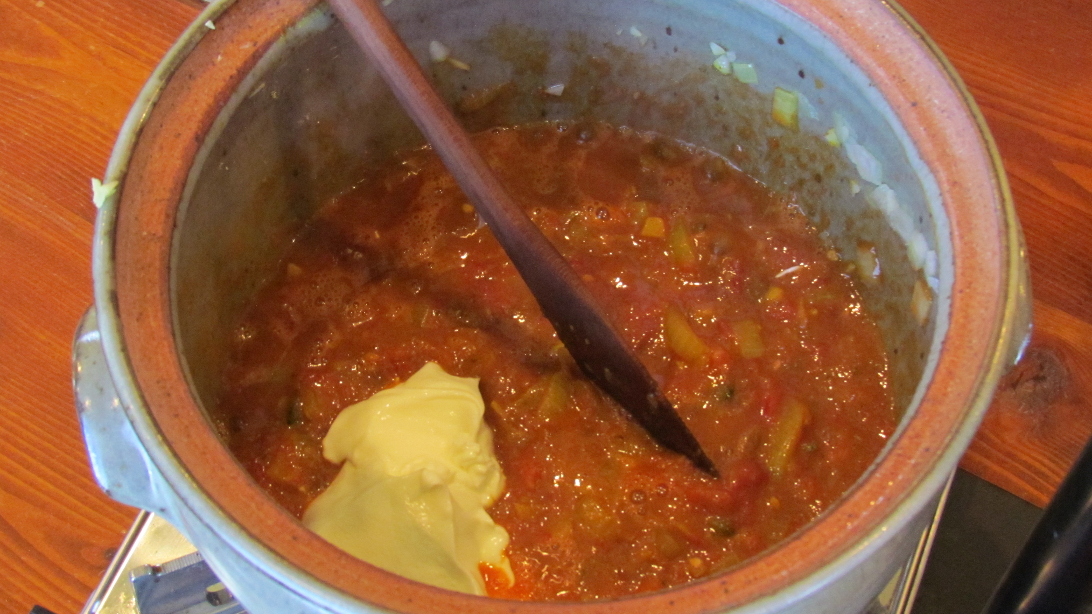 Mixing in yogurt to the stew base