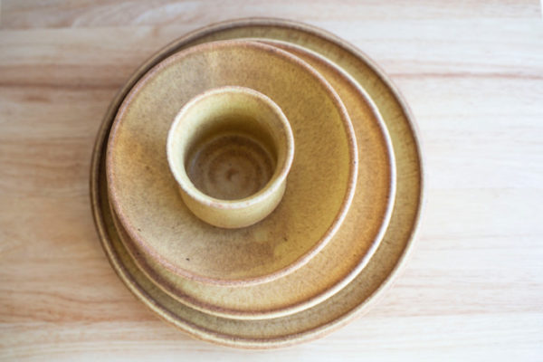 Clay Coyote Place Setting in Yellow Salt from above, dinner plate, salad plate, soup bowl, and cup.