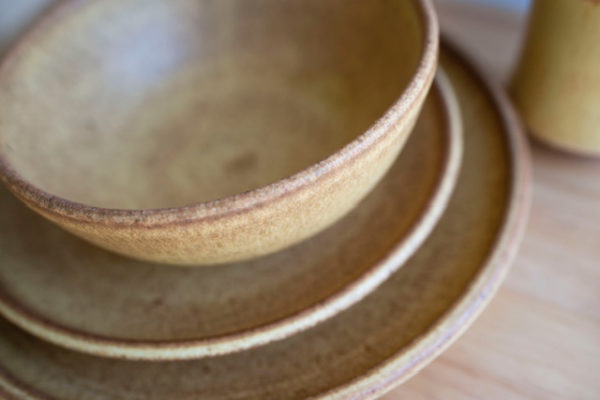 Clay Coyote Place Setting in Yellow Salt from above, dinner plate, salad plate, soup bowl, and cup. Detail
