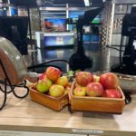 October 2022 Clay Coyote featured on WCCO Saturday Morning Show cooking with seasonal apples, pork, and pesto in a flameware cazuela and grill basket