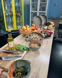 October 2022 Clay Coyote featured on WCCO Saturday Morning Show cooking with seasonal apples, pork, and pesto in a flameware cazuela and grill basket