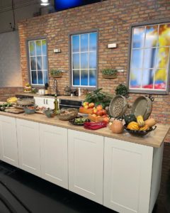 October 2022 Clay Coyote featured on WCCO Saturday Morning Show cooking with seasonal apples, pork, and pesto in a flameware cazuela and grill basket