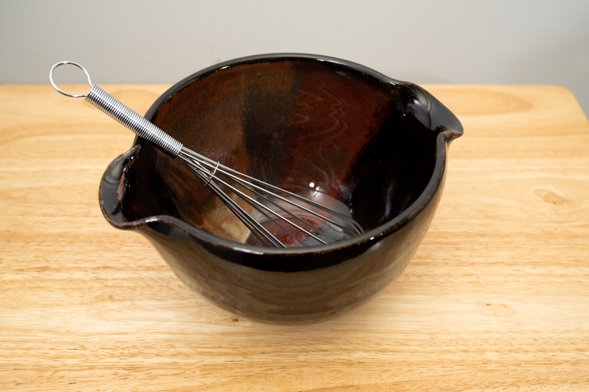 Clay Coyote Mixing Bowl with tiny wire whisk for whipping batter